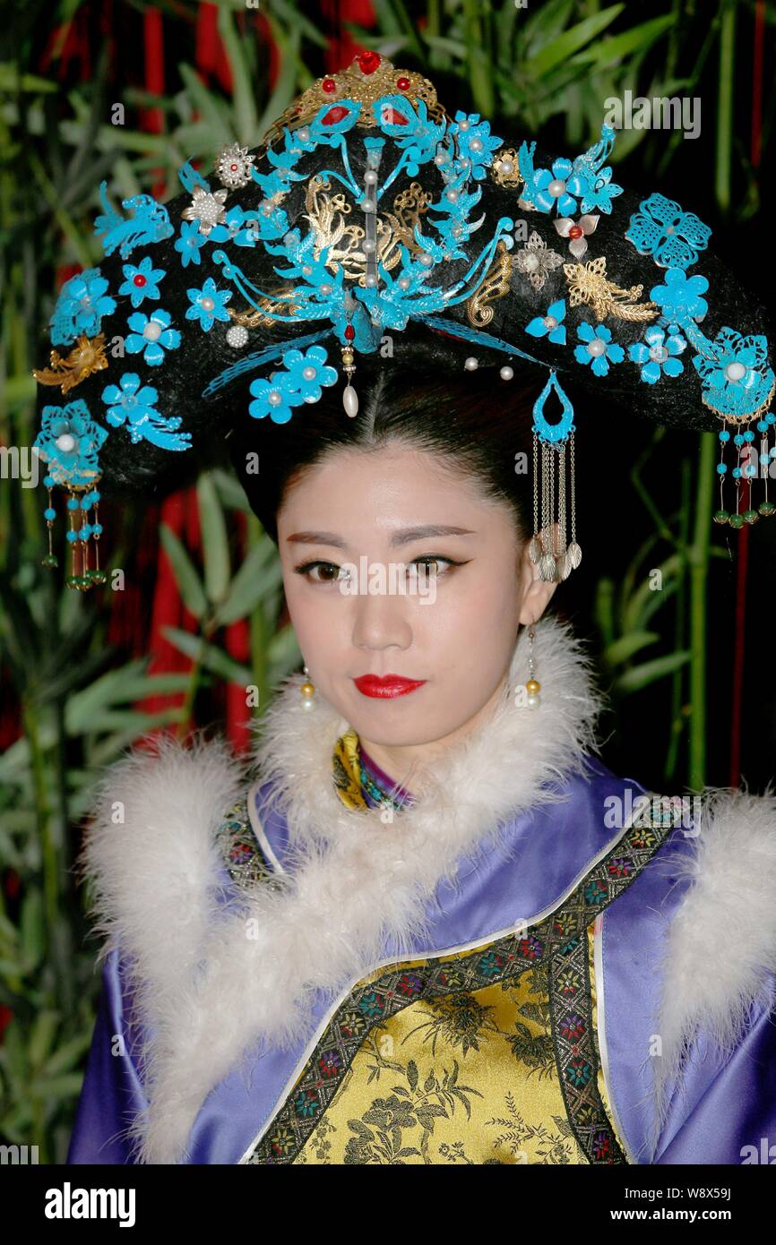 A member of South Korean girl group Swing Girls dressed in a traditional  Chinese royal costume poses for photos during a visit to a local ancient  cost Stock Photo - Alamy