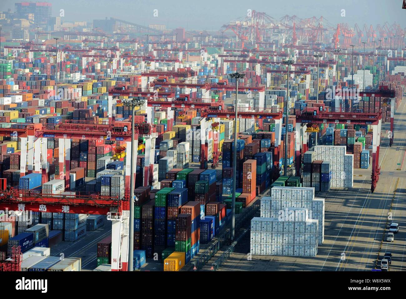 Stacks of Containers are seen at the Port of Qingdao in Qingdao city, east China's Shandong province, 8 December 2014.   China's imports shrank unexpe Stock Photo