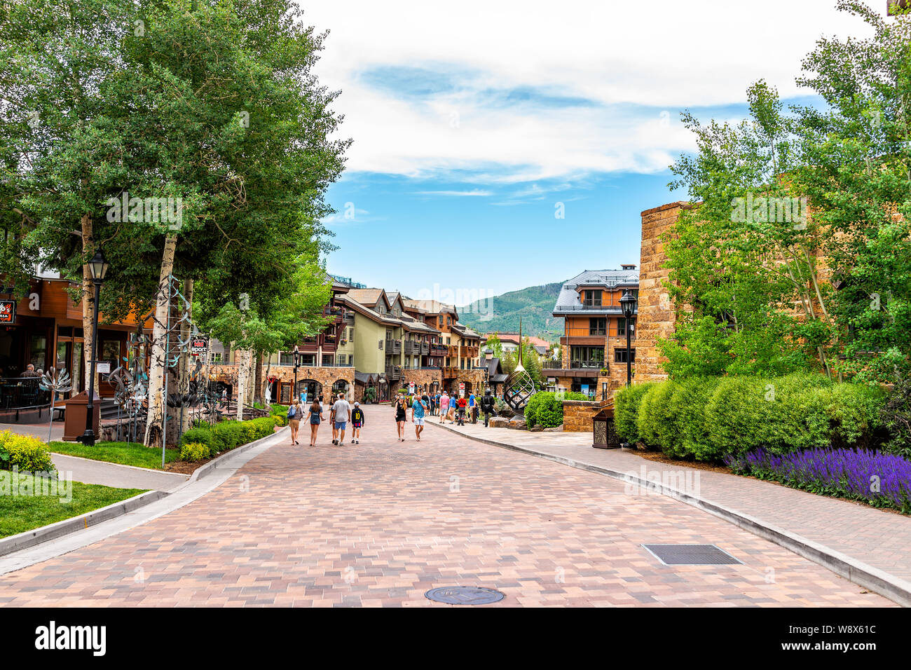 Vail, USA - June 29, 2019: People walking on cobblestone street shopping area in Colorado Stock Photo