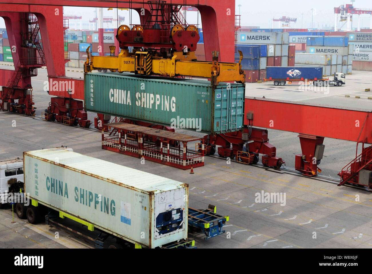 FILEA container of China Shipping Container Lines Co. is lifted on a quay at Port of Qingdao