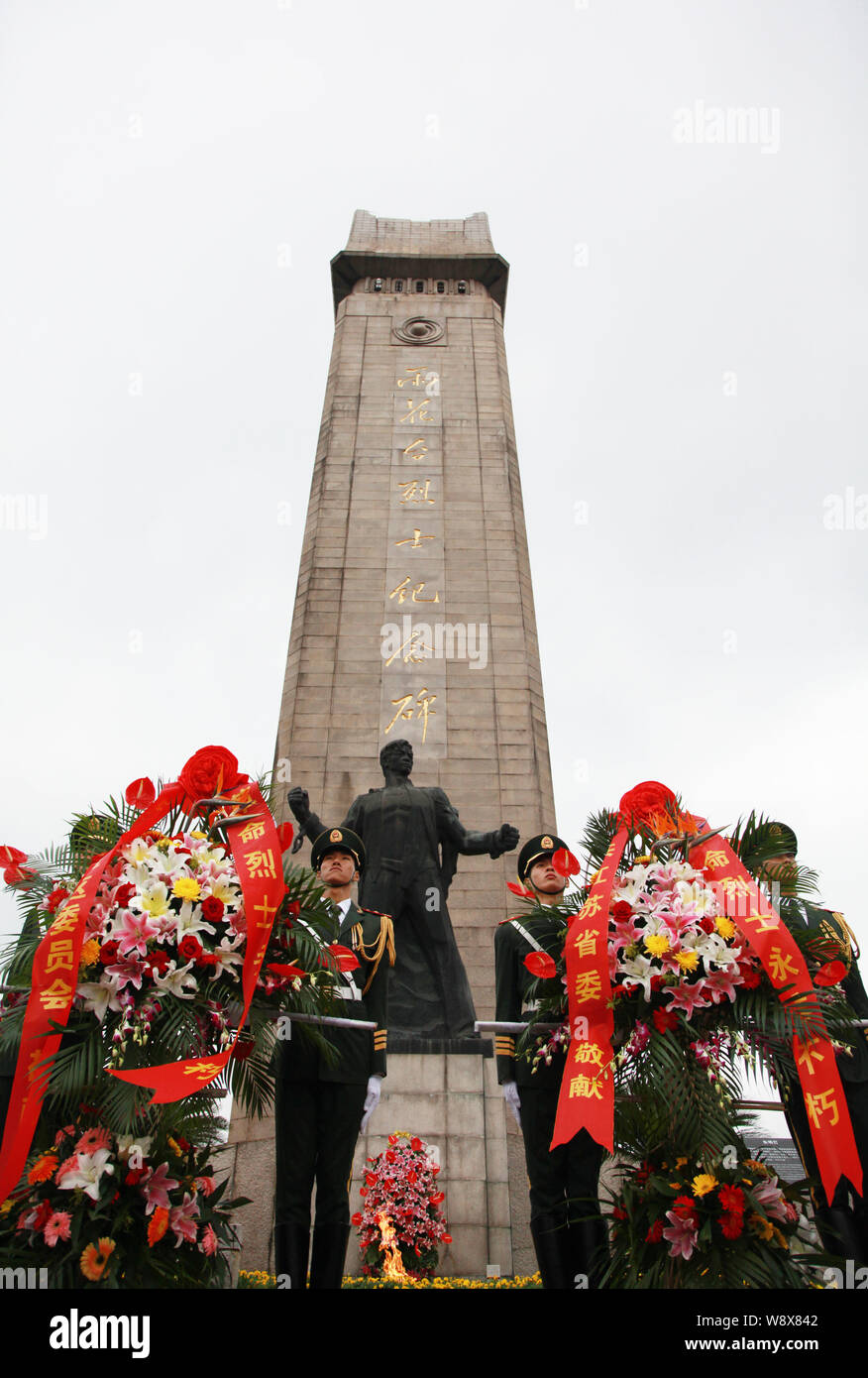 Chinese soldiers stand guard next to wreaths at the Yuhuatai Memorial Park of Revolutionary Martyrs on the first Martyrs' Day in Nanjing city, east Ch Stock Photo