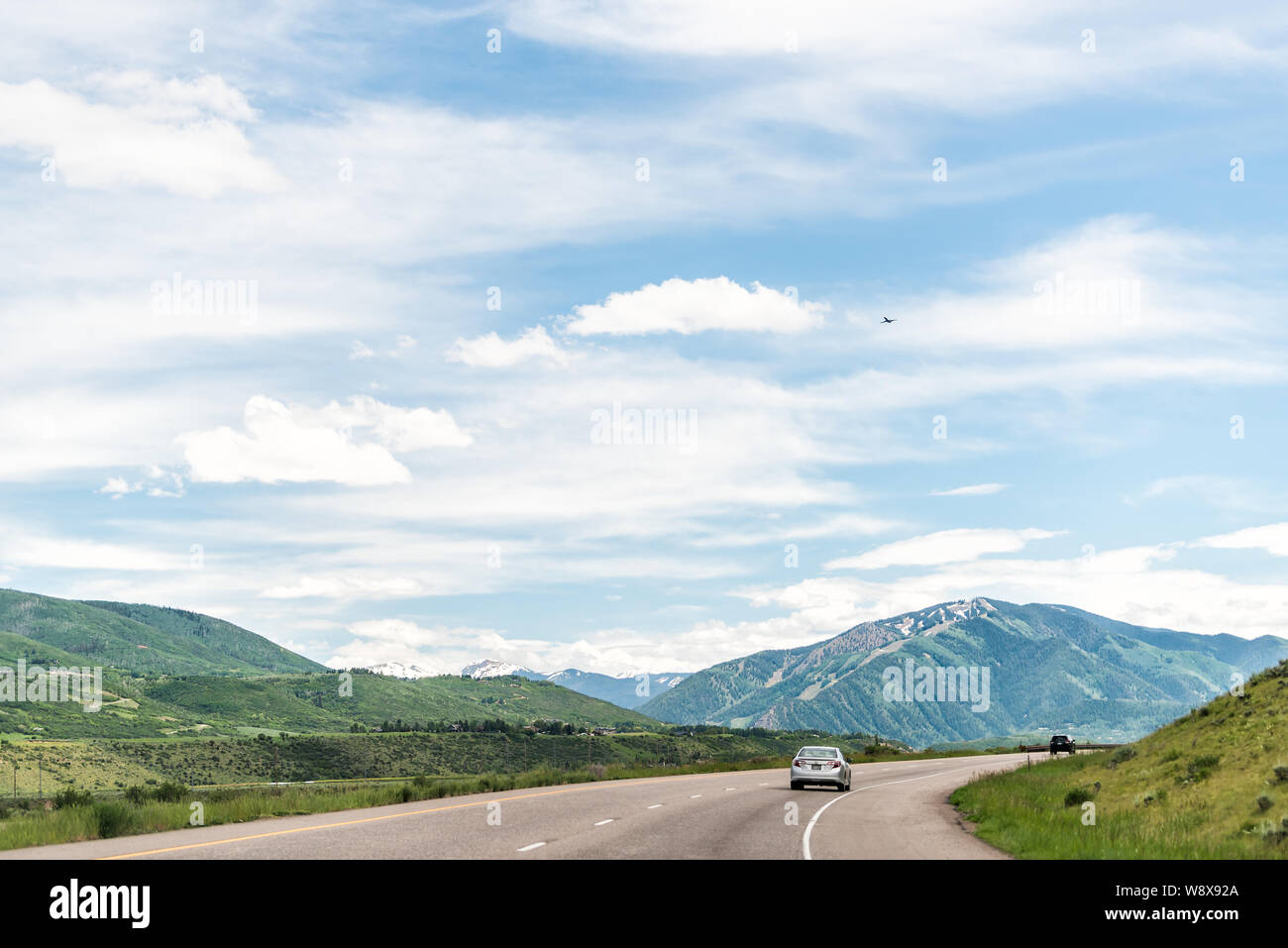 Basalt, USA - June 29, 2019: Road highway 82 to Aspen, Colorado town with cars in traffic and mountain range Stock Photo