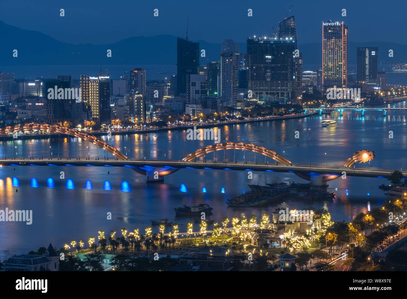 Overview of Danang city at dusk and night time, Vietnam Stock Photo