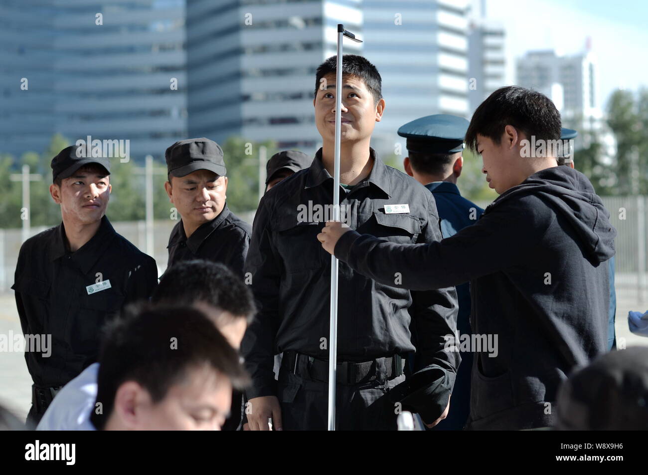Chinese security guards receive physical examinations for the upcoming APEC summit in Beijing, China, 26 October 2014.   As Beijing finishes what migh Stock Photo