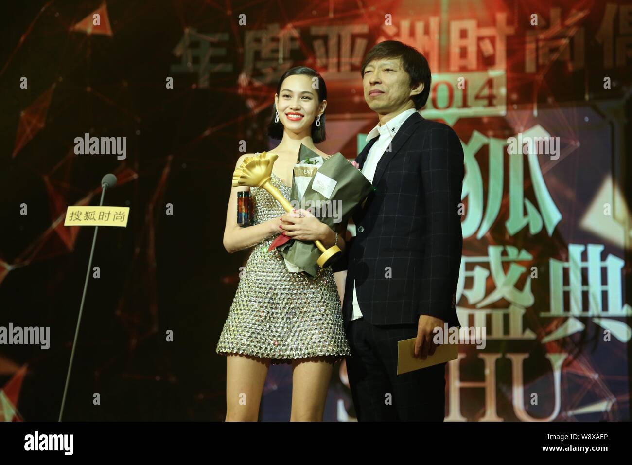 Japanese actress Kiko Mizuhara, left, poses with Charles Zhang Chaoyang