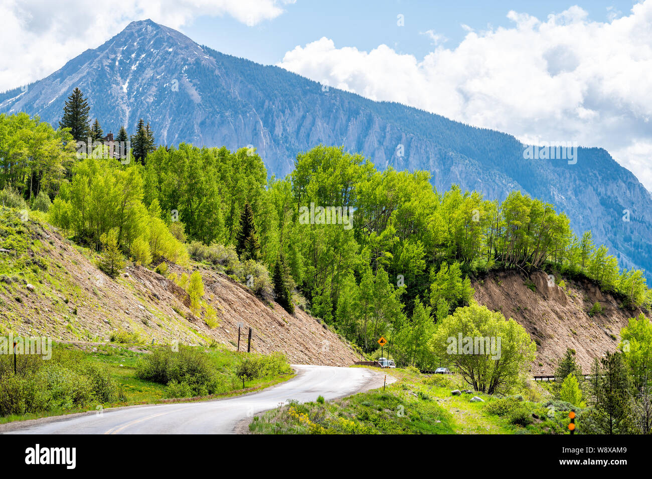 Crested Butte Kebler Pass mountain view and road with cloudy sky in