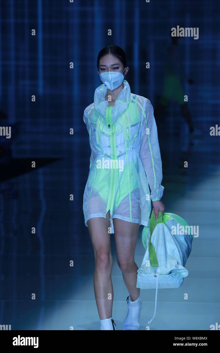 A model displays a new creation by designer Yi Peng at the Qiaodan Yi Peng fashion show during the China Fashion Week Spring/Summer 2015 in Beijing, C Stock Photo