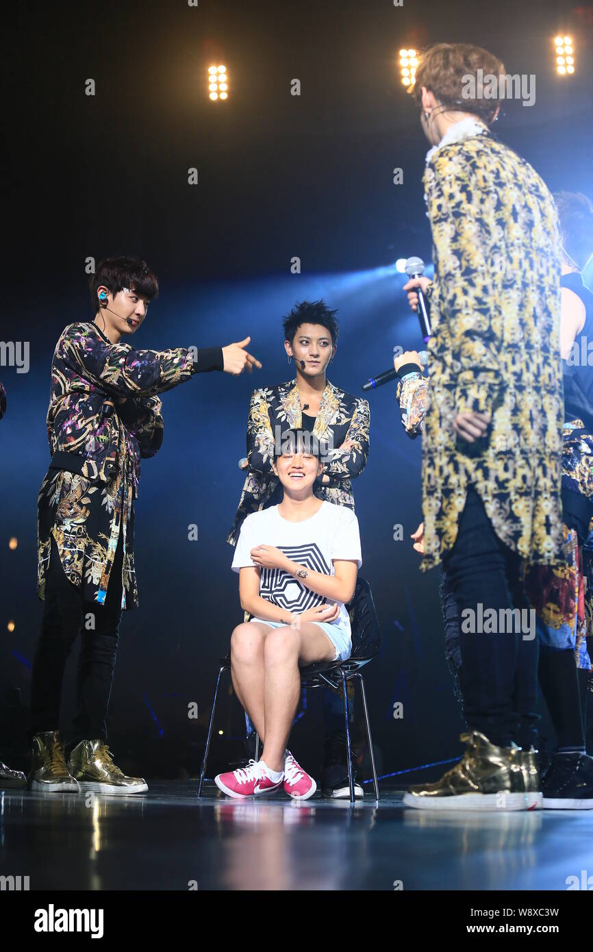 South Korean Chinese K Pop Boy Group Exo Interacts With A Chinese Fan At The Concert Of Their World Tour Exo From Exoplanet The Lost Planet In Shan Stock Photo Alamy