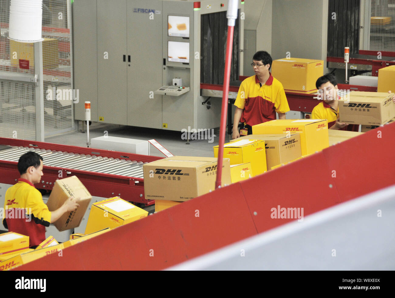 Dhl Sort --FILE--Chinese workers put sort parcels during a test at the new DHL ...