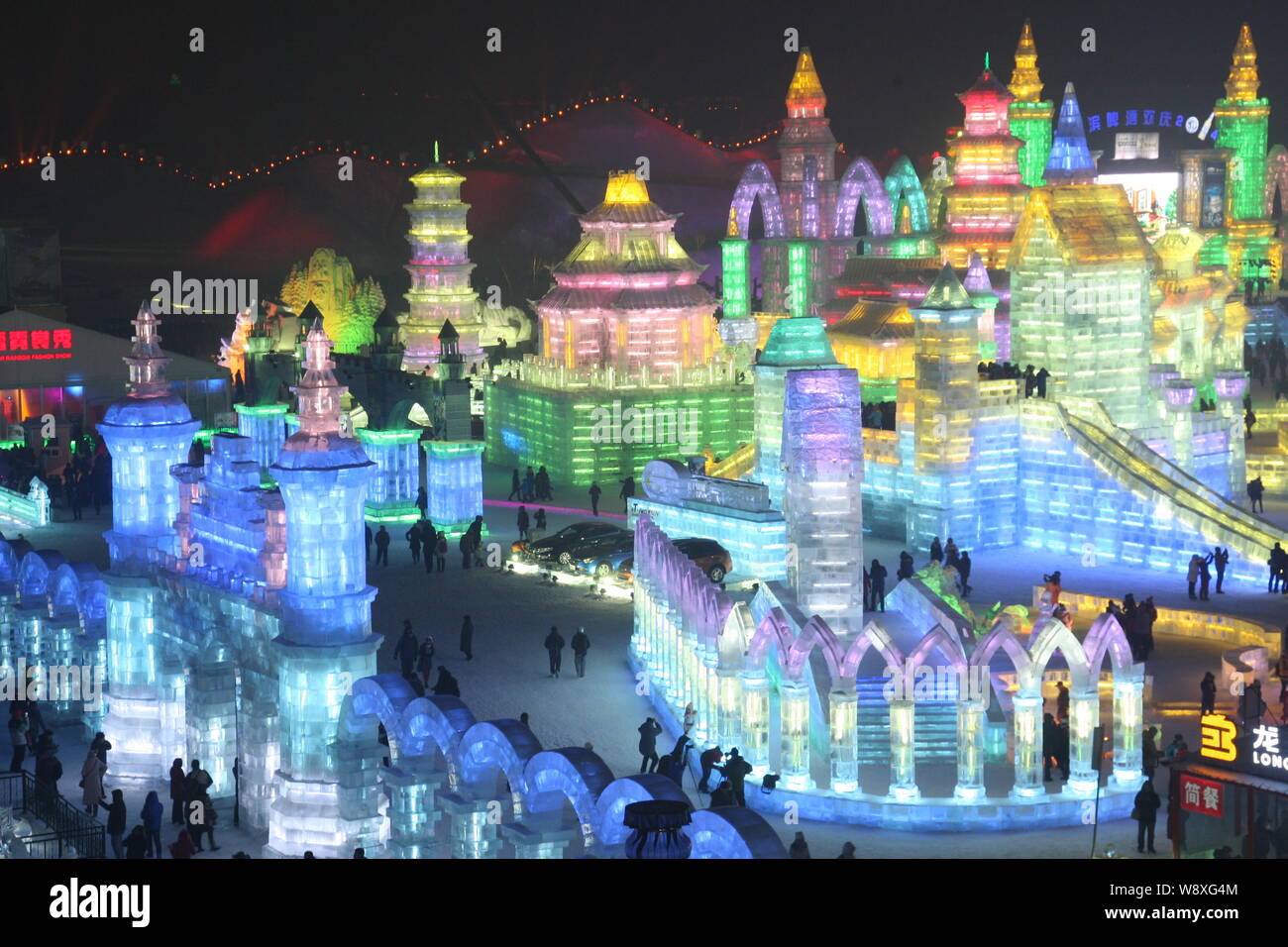 Visitors Walk Past Ice Sculptures At The 30th Harbin International Ice visitors-walk-past-ice-sculptures-at-the-30th-harbin-international-ice