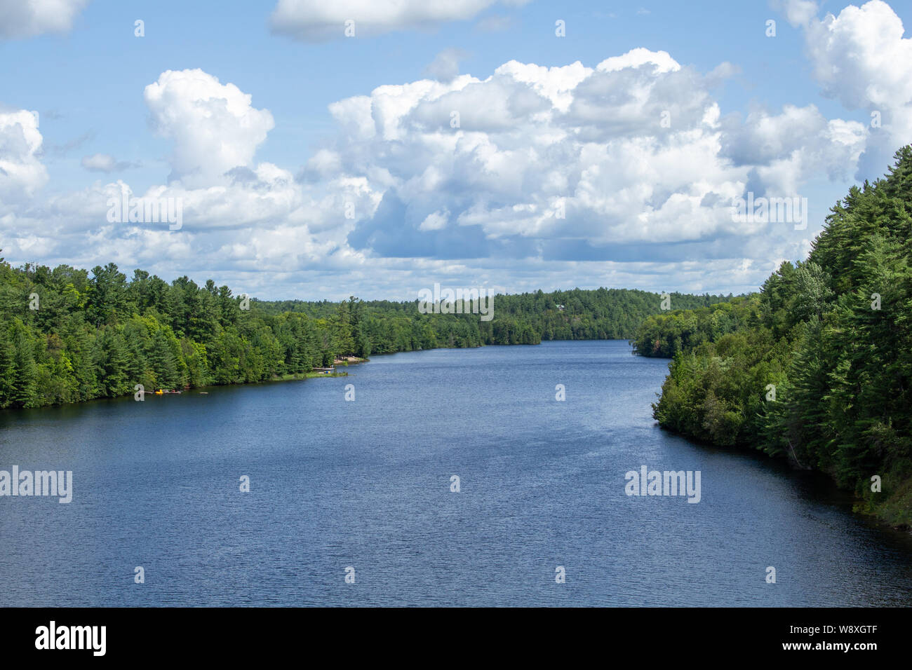 The Madawaska River in Ontario takes a winding path from Algonquin Park to the Ottawa River at Arnprior. This view from a crossing at Burnstown shows Stock Photo