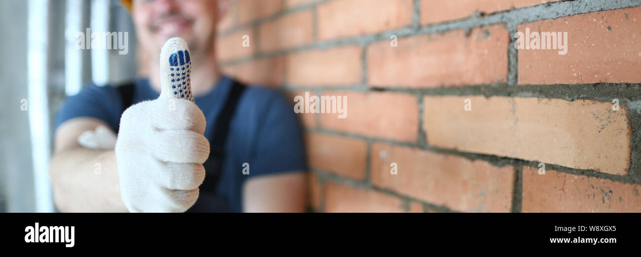 Smiling man showing thumb up Stock Photo