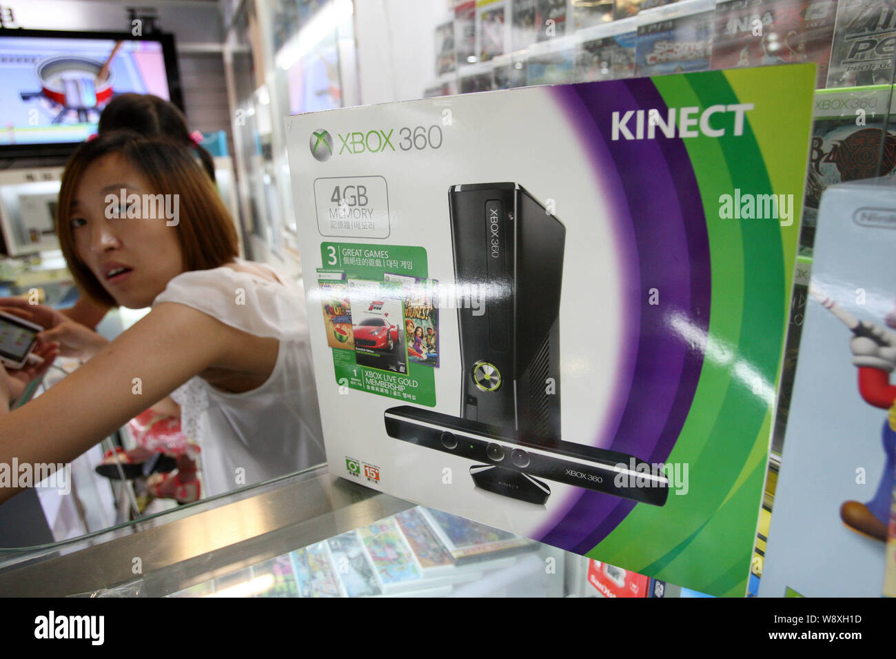 --FILE--A Microsoft XBOX 360 game console is for sale at a stall in a digital products mall in Shanghai, China, 10 July 2013.   After 13 long years, C Stock Photo