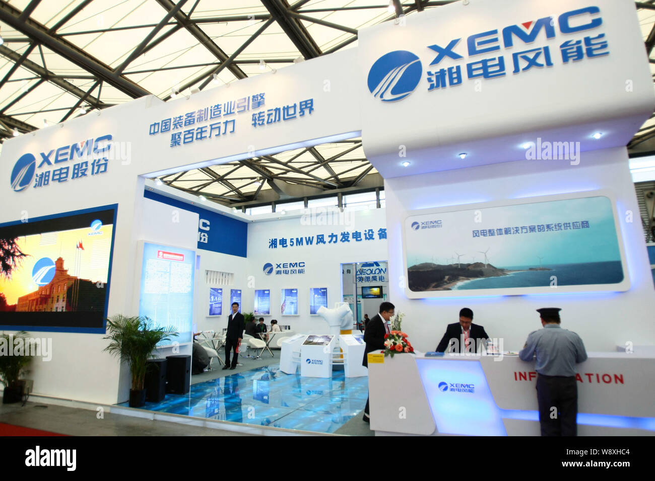 --FILE--People visit the stand of XEMC (Xiangtan Electric Manufacturing Group Co., Ltd.) at an exhibition in Shanghai, China, 26 April 2012.   Austral Stock Photo