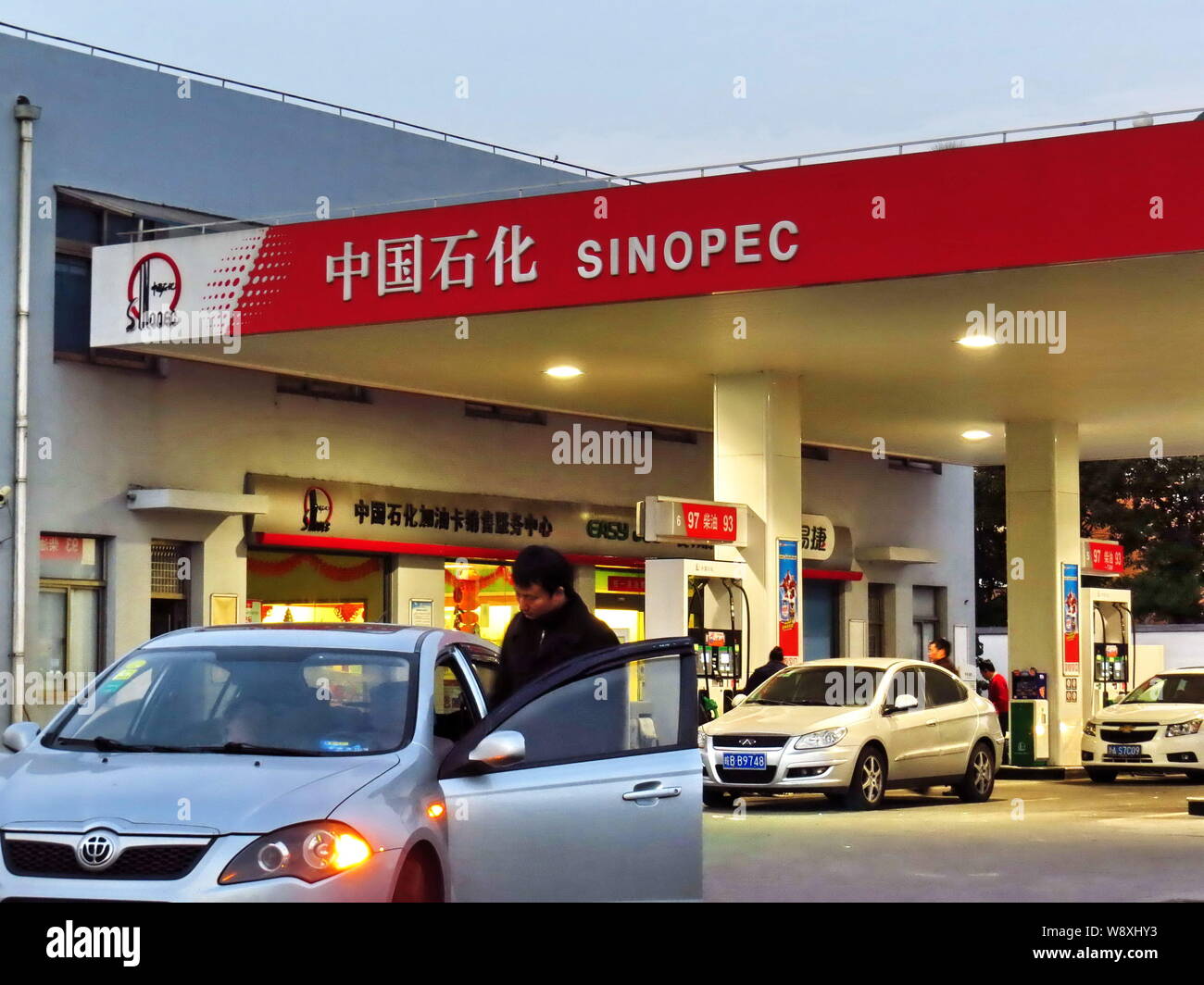--FILE--Cars are being refueled at a gas station of Sinopec in Shanghai, China, 24 February 2013.   China Petroleum and Chemical Corporation (Sinopec) Stock Photo