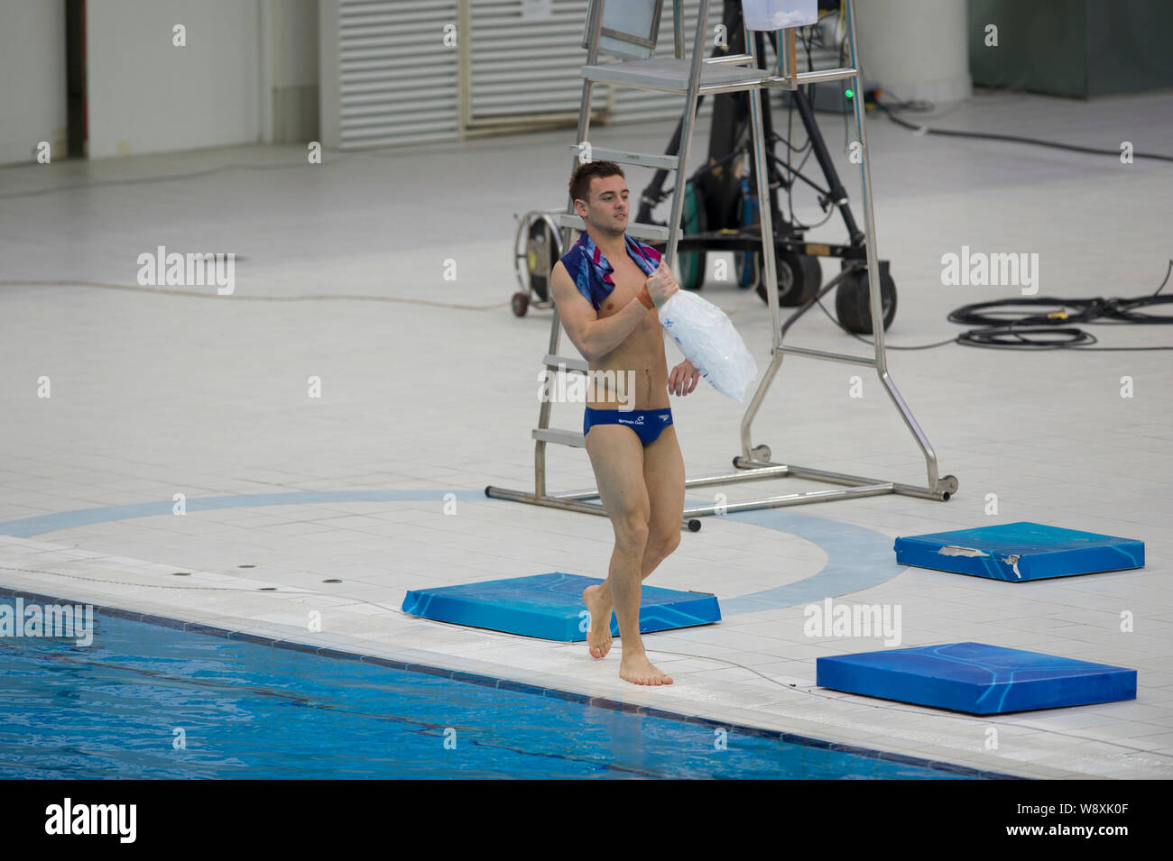 English diver Tomas Daley holds an ice bag during a training session of the FINA/NVC Diving World Series 2014 at the National Aquatics Center, also kn Stock Photo