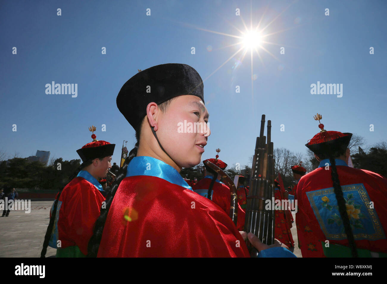 Chinese performers dressed in ancient costumes of the Qing Dynasty (1644-1911) take part in a rehearsal of a sun worship ritual at Ritan Park in Beiji Stock Photo