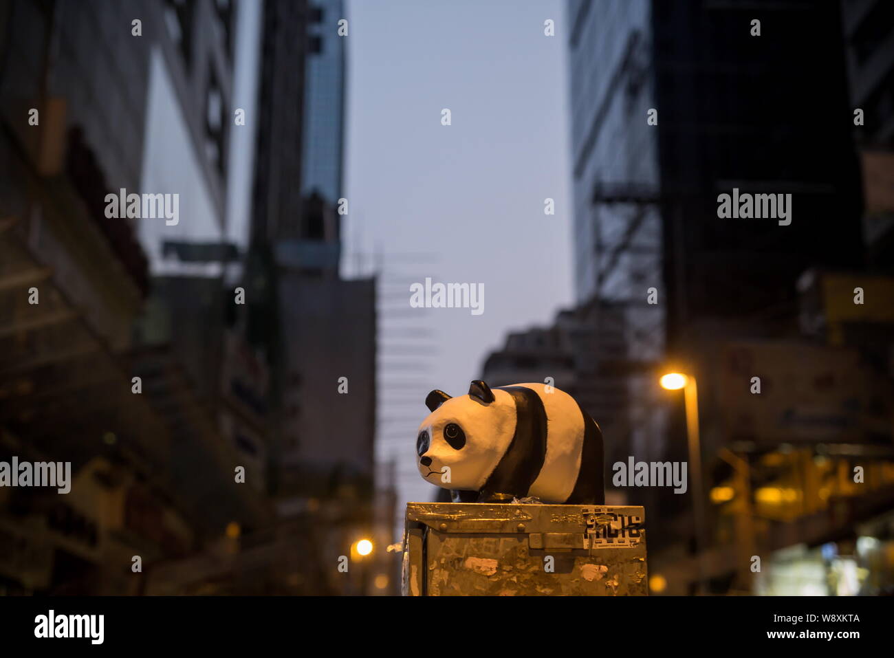 A paper panda created by French artist Paulo Grangeon is displayed on a street in Mongkok during the 1600 Pandas World Tour exhibition in Hong Kong, C Stock Photo