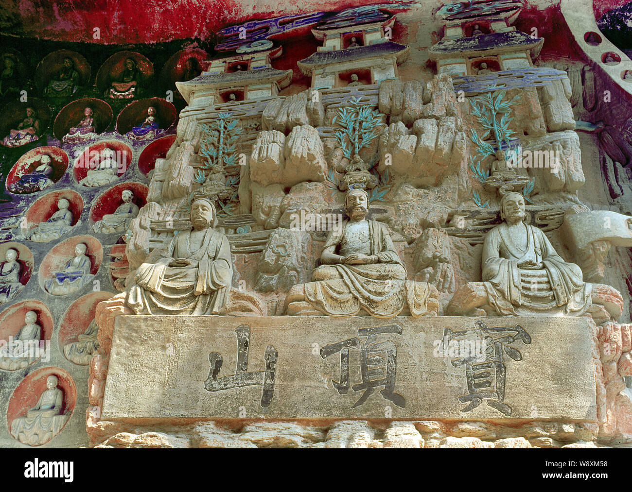 View of Dazu rock carvings of buddhas on Mount Baoding, or Bao Ding Mountain, in Dazu County, Chongqing, China. Stock Photo