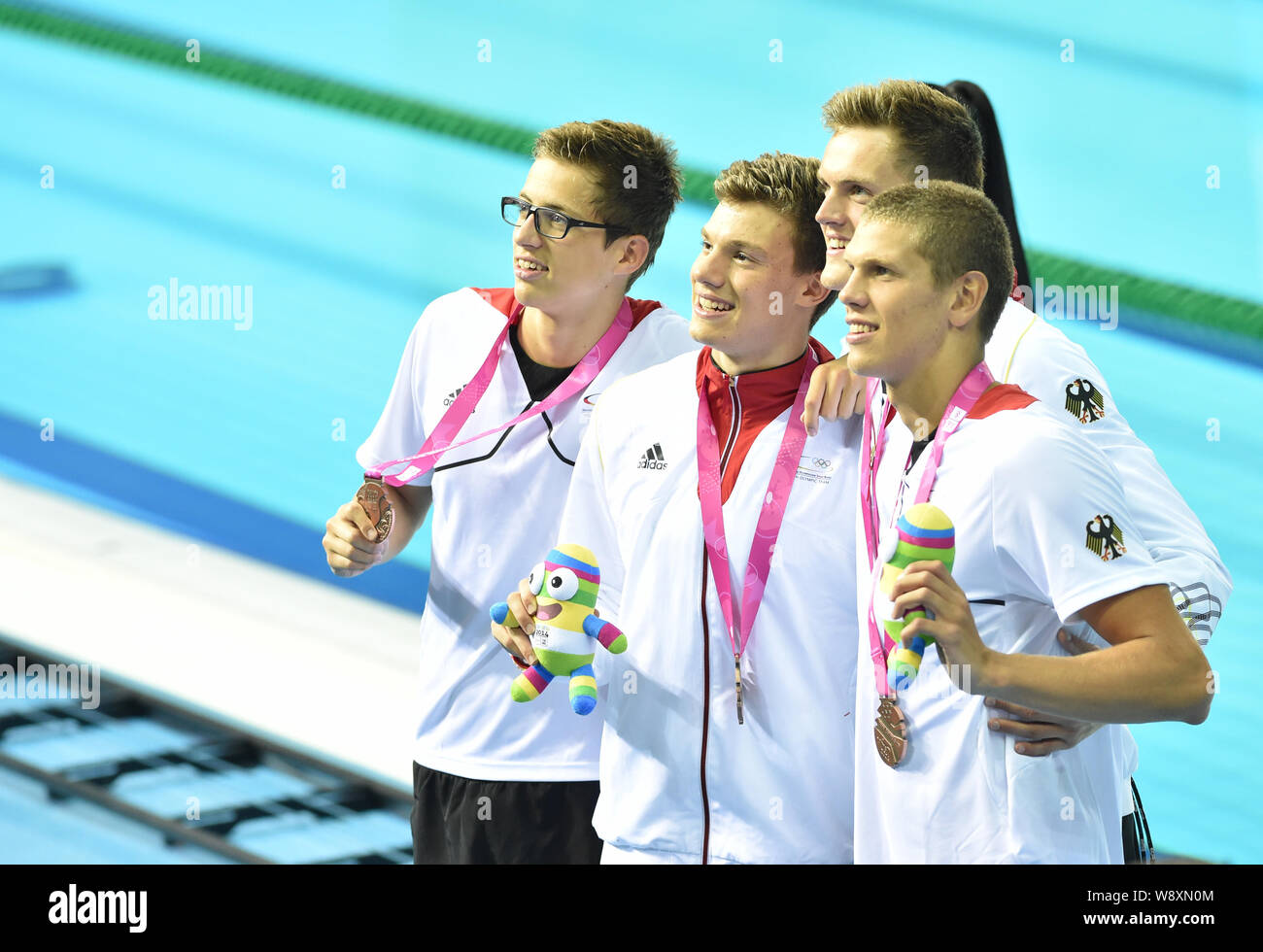 (From left) Bronze medalists Damian Wierling, Maximilian Pilger, Marek Ulrich and Alexander Kunert of Germany at the award ceremony for Men¯s 4 x 100m Stock Photo
