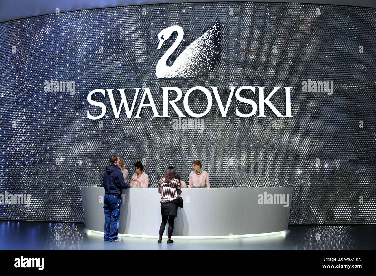 People visit the stand of Swarovski during the Baselworld Watch and  Jewellery Show 2014 in Basel, Switzerland, 26 March 2014. The worlds  biggest wat Stock Photo - Alamy