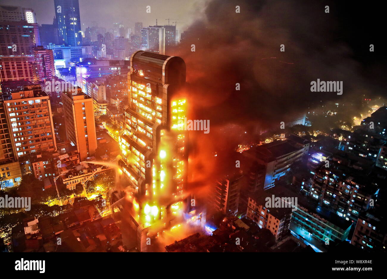 The 25 Story Jianye Building Is Seen On Fire In Guangzhou City South Chinas Guangdong Province 15 December 13 An Unfinished High Rise Building Stock Photo Alamy