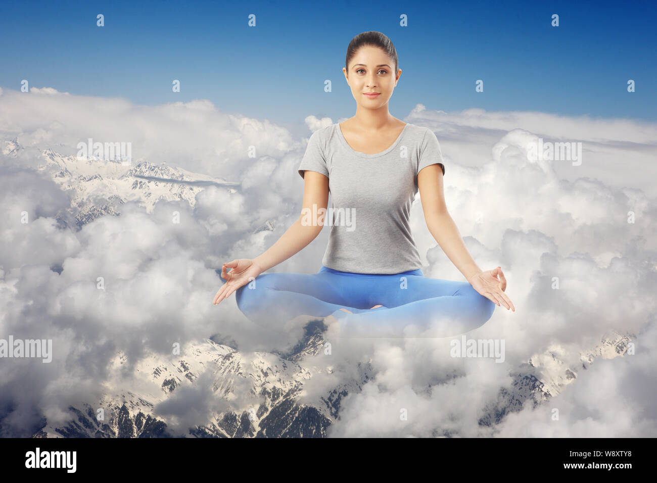 Young woman practicing yoga Stock Photo