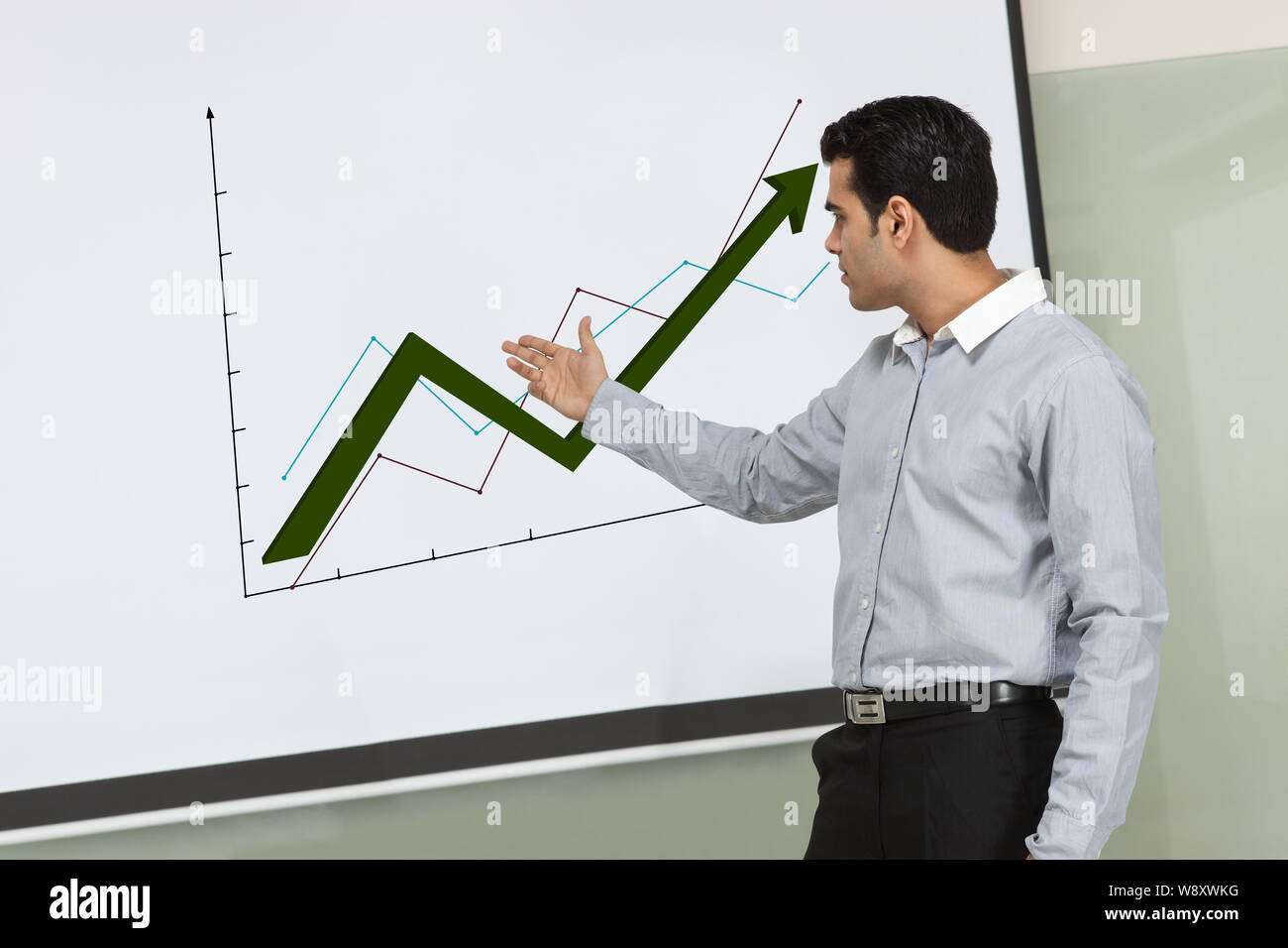 Businessman showing graph rising upward Stock Photo - Alamy