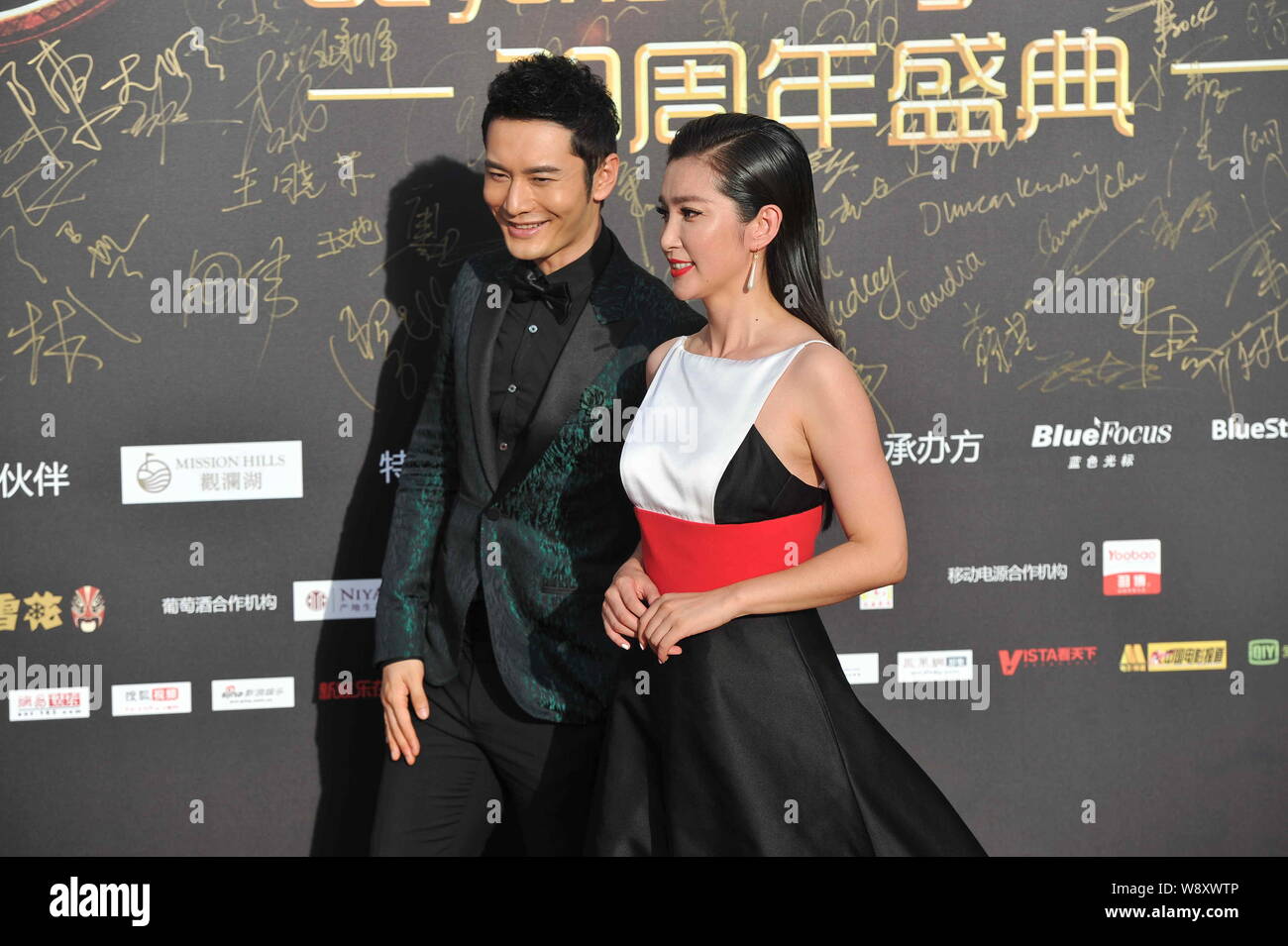 Chinese actor Huang Xiaoming, left, and actress Li Bingbing arrive on