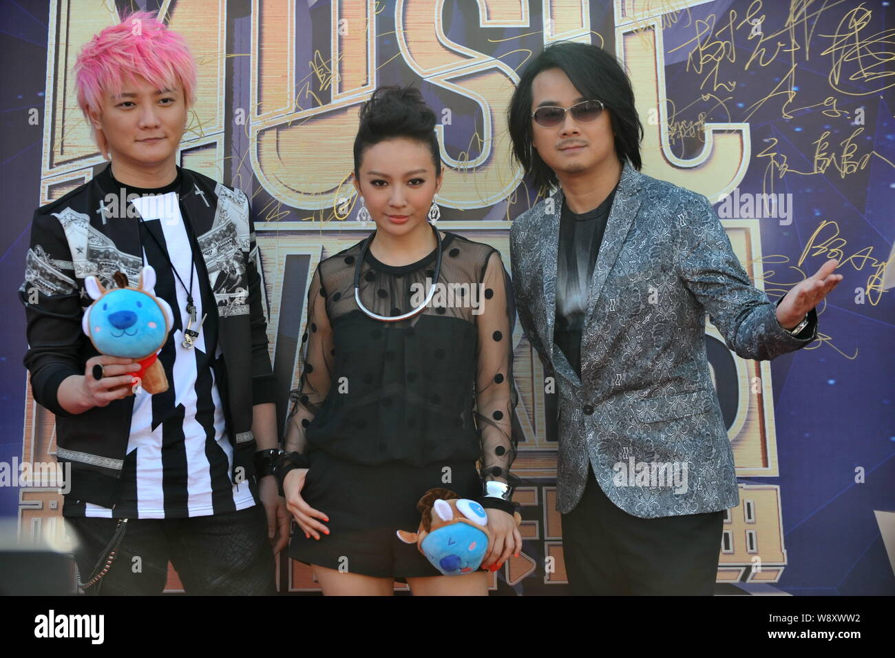 Members of Taiwanese band F.I.R. pose on the red carpet as they arrive ...