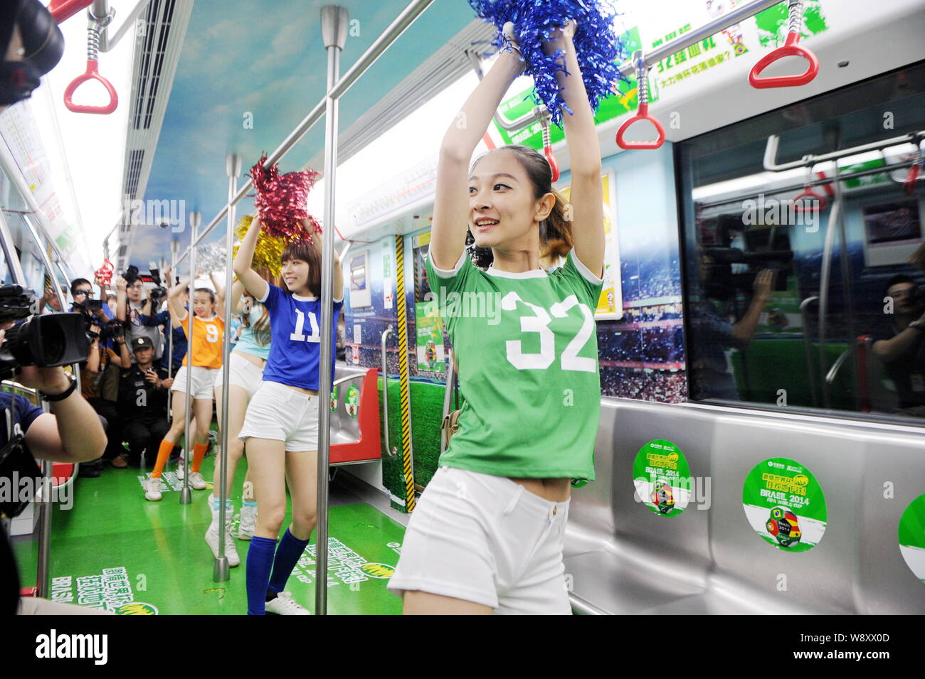 Young Chinese cheerleaders dance aboard the special train of Hangzhou