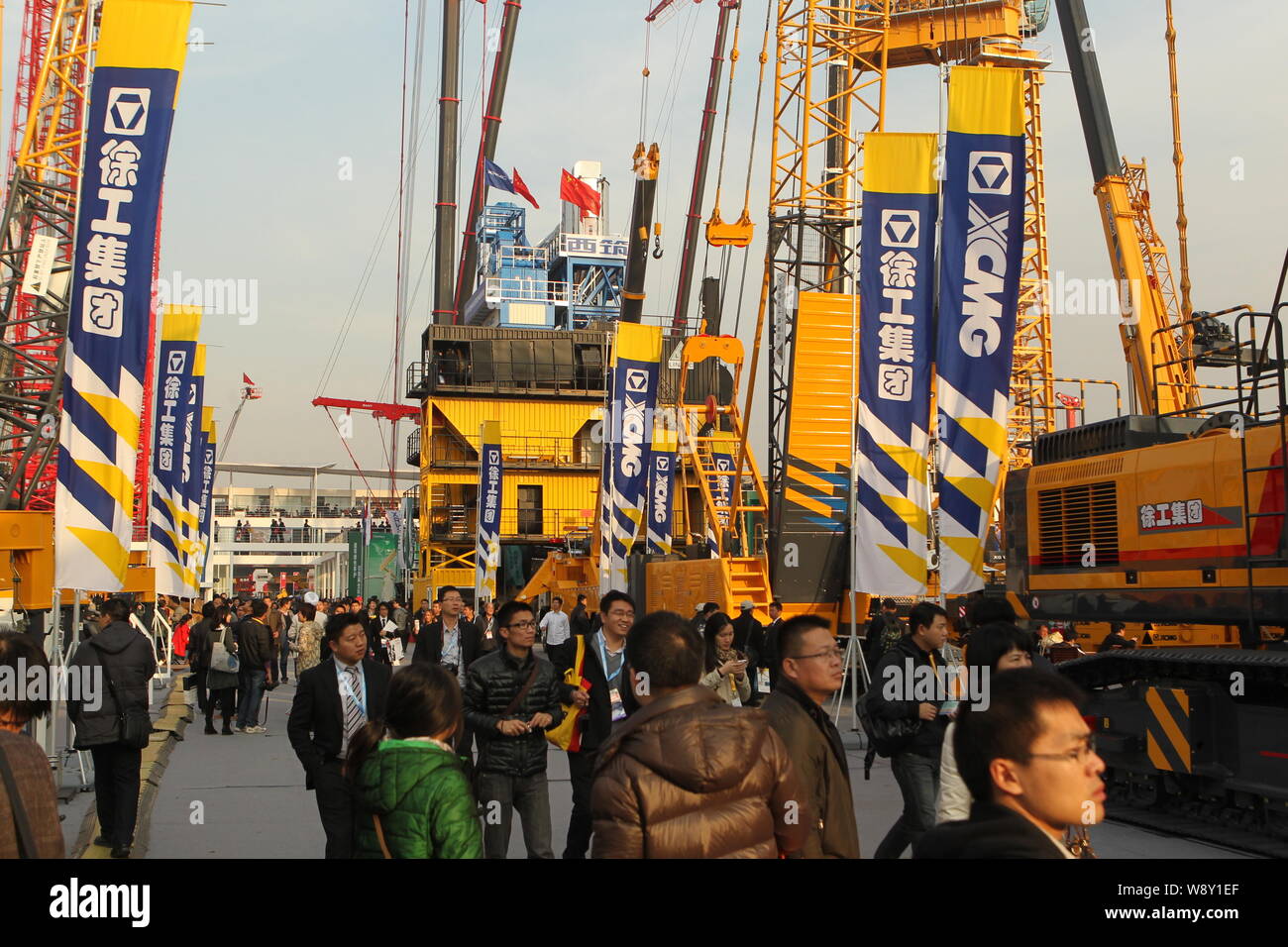 --FILE--Visitors look at the construction machineries of XCMG during the 2012 International Trade Fair for Construction Machinery, Building Material M Stock Photo