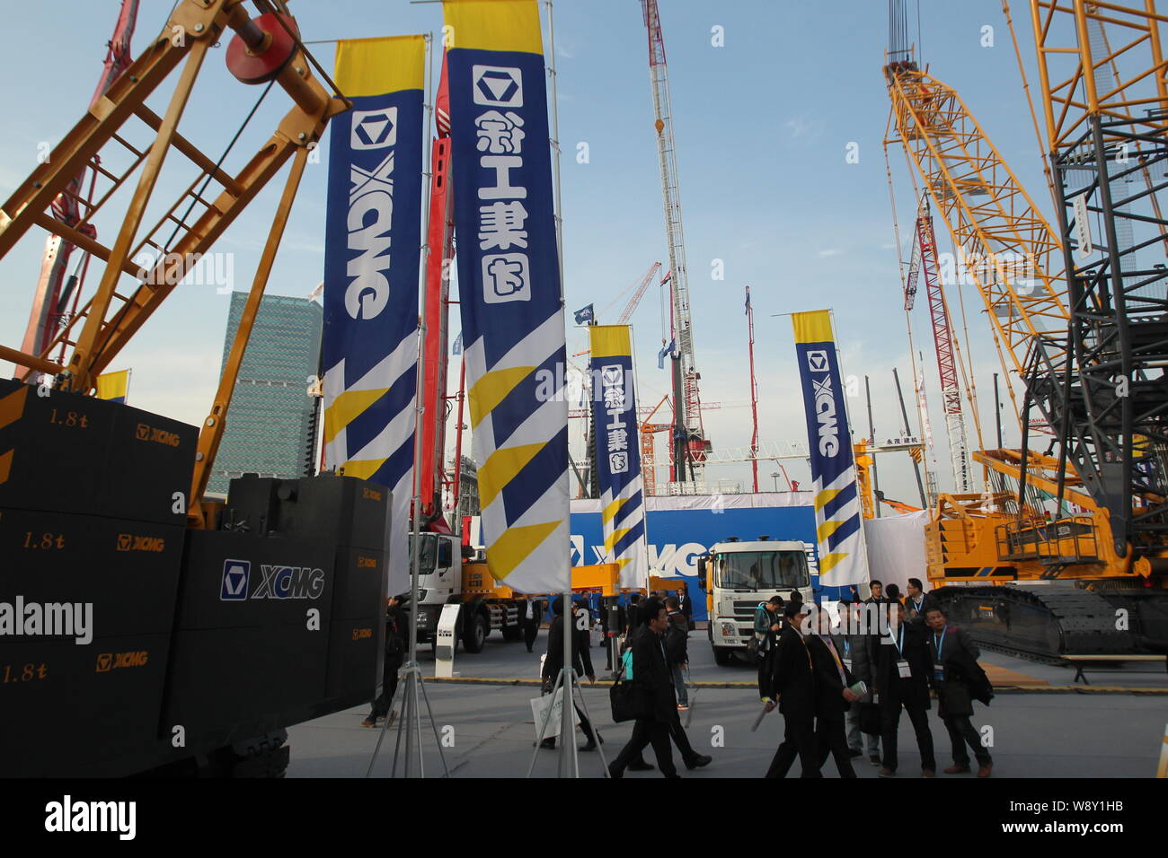 --FILE--Visitors look at the construction machineries of XCMG during the 2012 International Trade Fair for Construction Machinery, Building Material M Stock Photo
