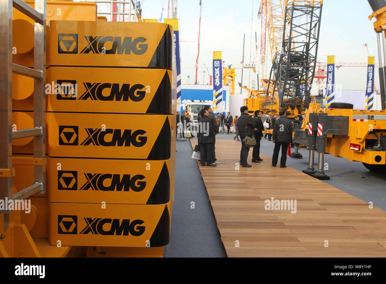 --FILE--Visitors look at the construction machineries of XCMG during the 2012 International Trade Fair for Construction Machinery, Building Material M Stock Photo