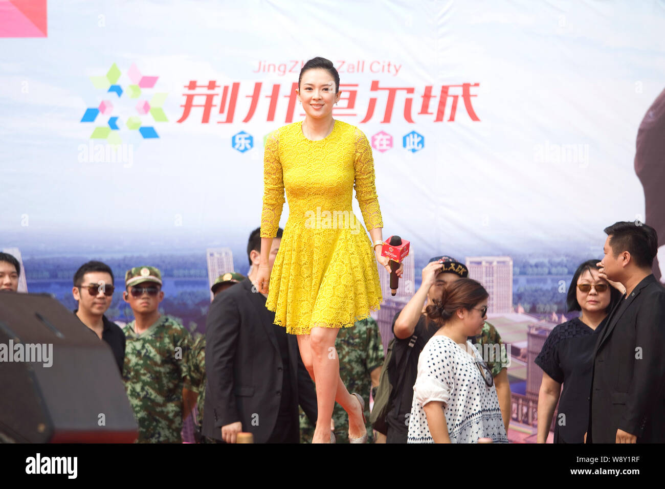 Chinese actress Zhang Ziyi, front, arrives at the opening ceremony for residential apartment project Jingzhou Zall City in Jingzhou city, central Chin Stock Photo
