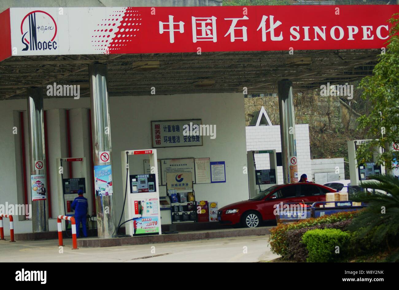 A car is being refueled at a gas station of Sinopec in Yichang city, central Chinas Hubei province, 24 March 2014.   China Petroleum and Chemical Corp Stock Photo
