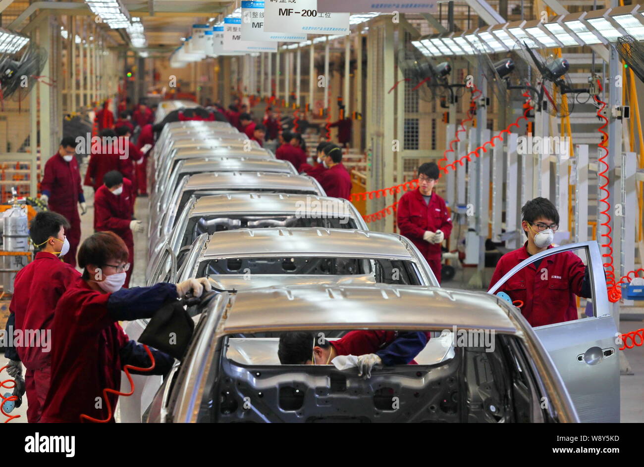 --FILE--Chinese workers assemble cars on the assembly line at the auto ...