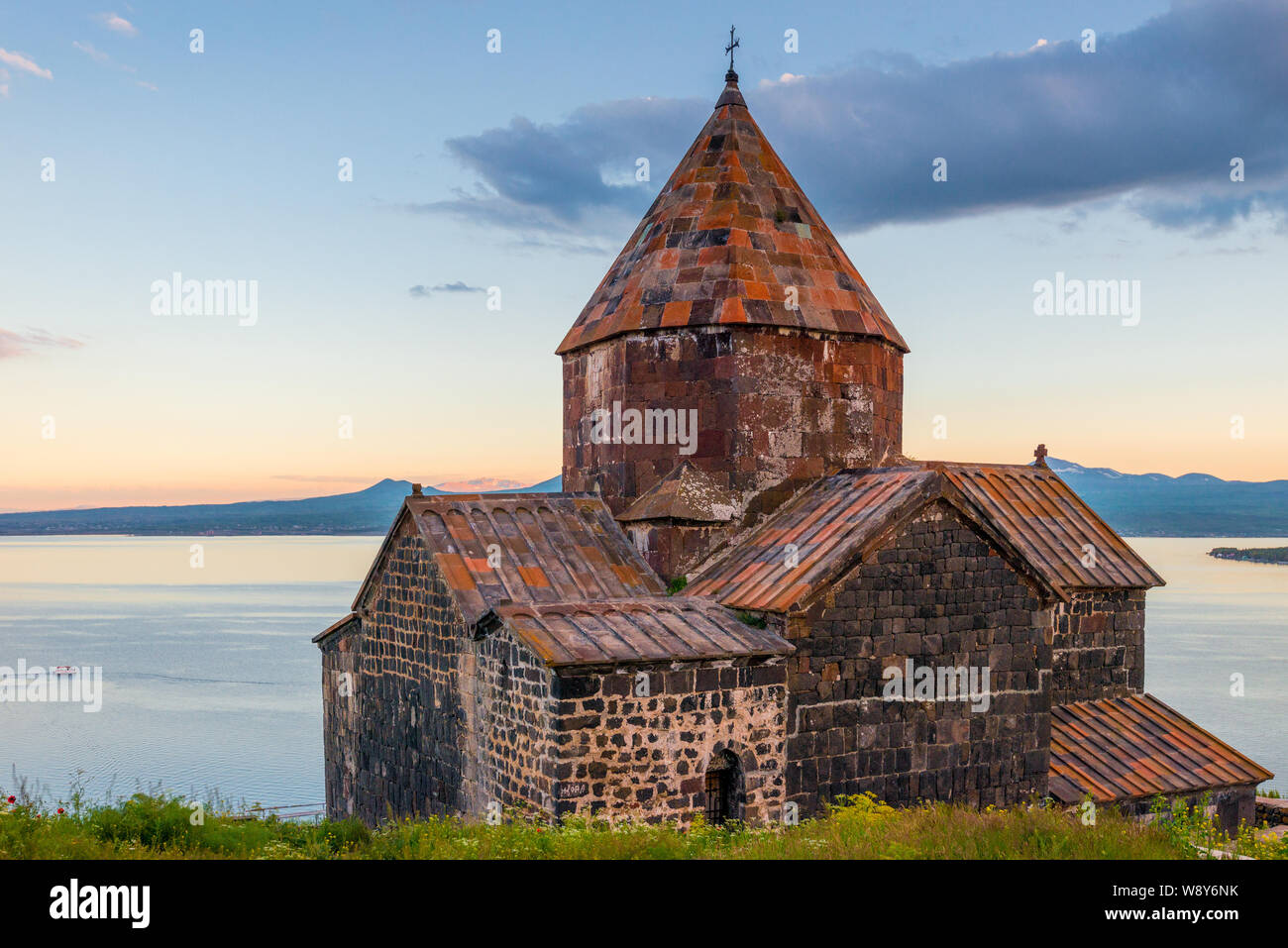 Ancient famous monastery Sevanavank at sunset, view of Lake Sevan, Armenia Stock Photo