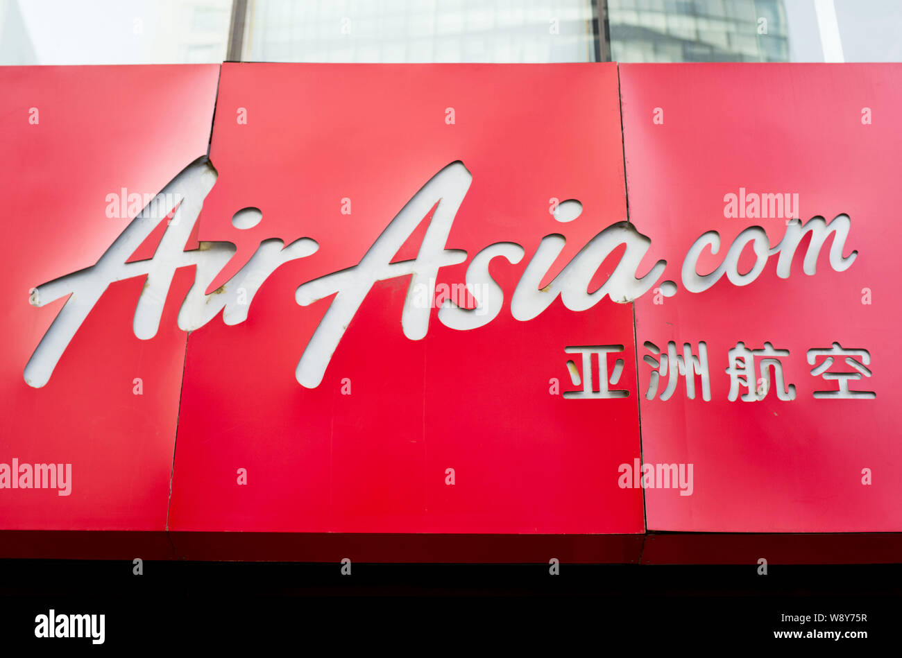 --FILE--A signboard of AirAsia is seen in front of its Beijing branch in Beijing, China, 4 February 2014.    AirAsia Bhd, the Malaysia-based low-cost Stock Photo