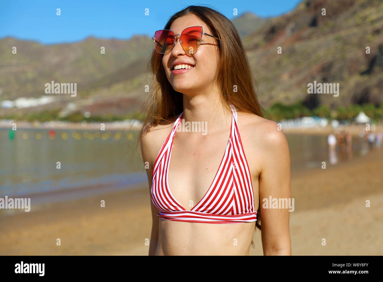 Beautiful joyful girl in bikini enjoying tropical beach in her ...