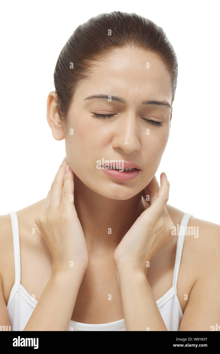 Young woman suffering from neck pain Stock Photo Alamy
