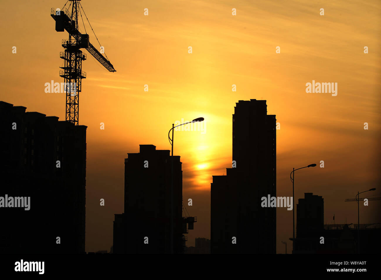 --FILE--New high-rise residential apartment buildings are under construction in Nantong city, east Chinas Jiangsu province, 26 January 2014.   Housing Stock Photo
