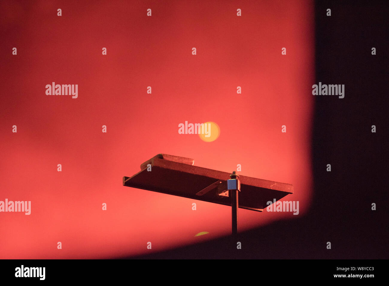 Musical instrumental desk in red stage lights Stock Photo Alamy
