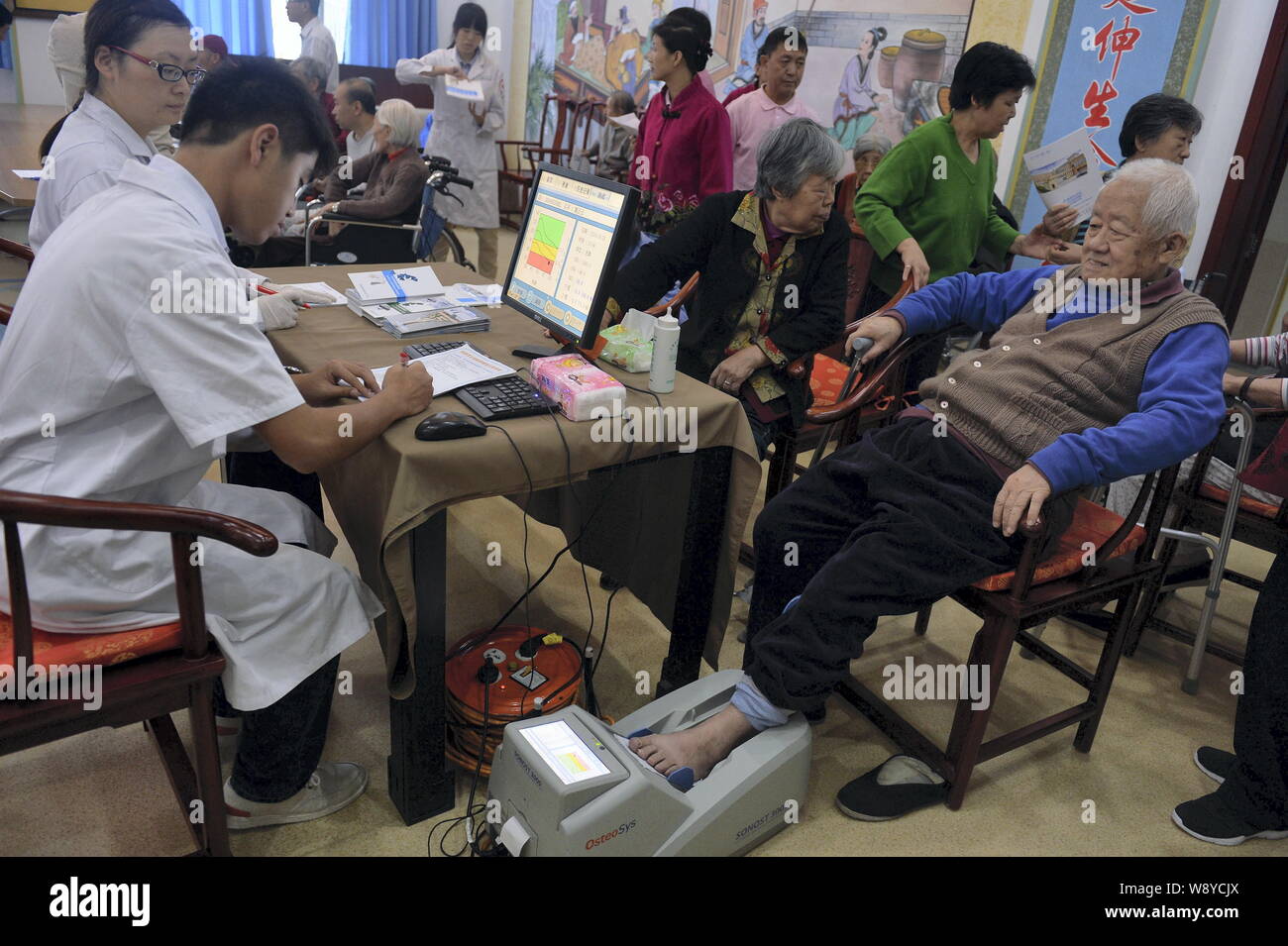 --FILE--Senior citizens take physical examinations at a nursing home in Beijing, China, 26 September 2014.       A report on the industry published by Stock Photo
