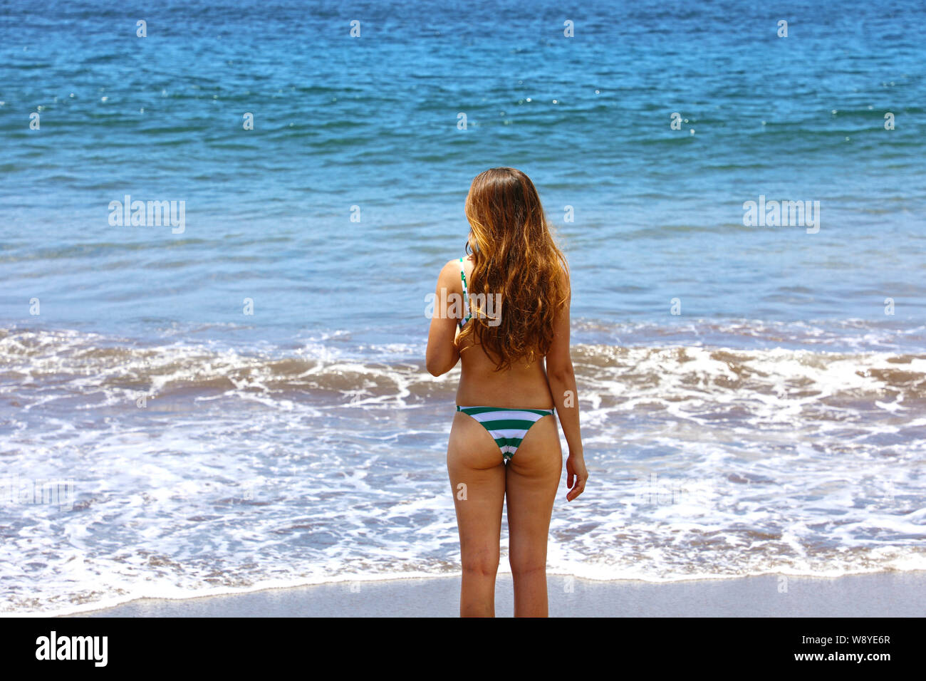 Back View Woman Standing On The Beach Stock Photo Alamy