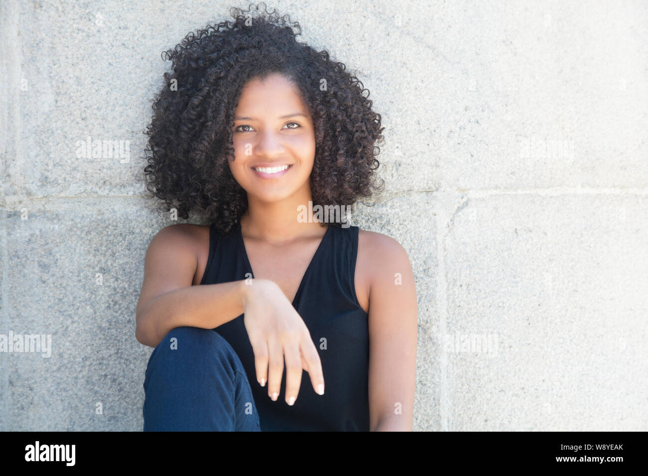 Beautiful African American Woman With Curly Black Hair Outdoor In