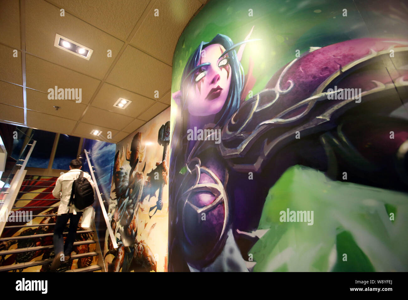 A customer walks upstairs with his food at a WorldofWarcraftthemed fastfood restaurant of