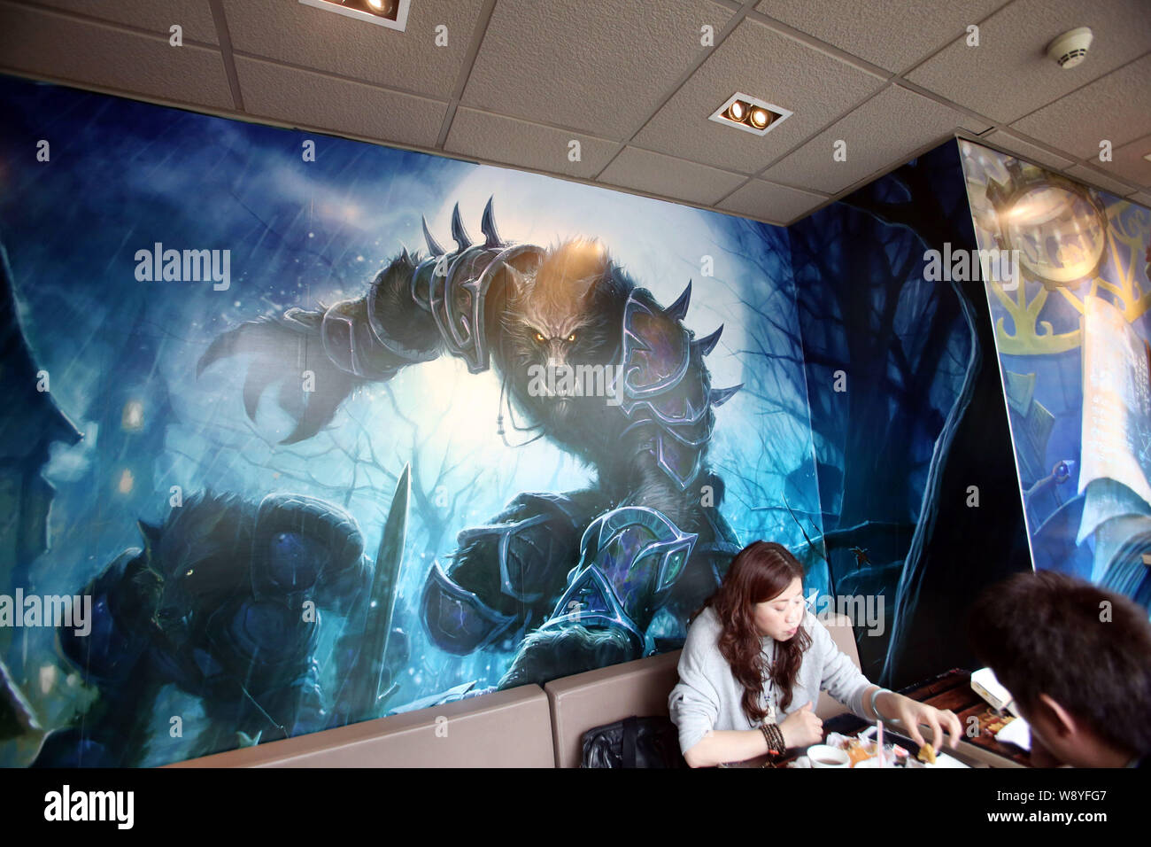 Customers eat food at a WorldofWarcraftthemed fastfood restaurant of McDonald
