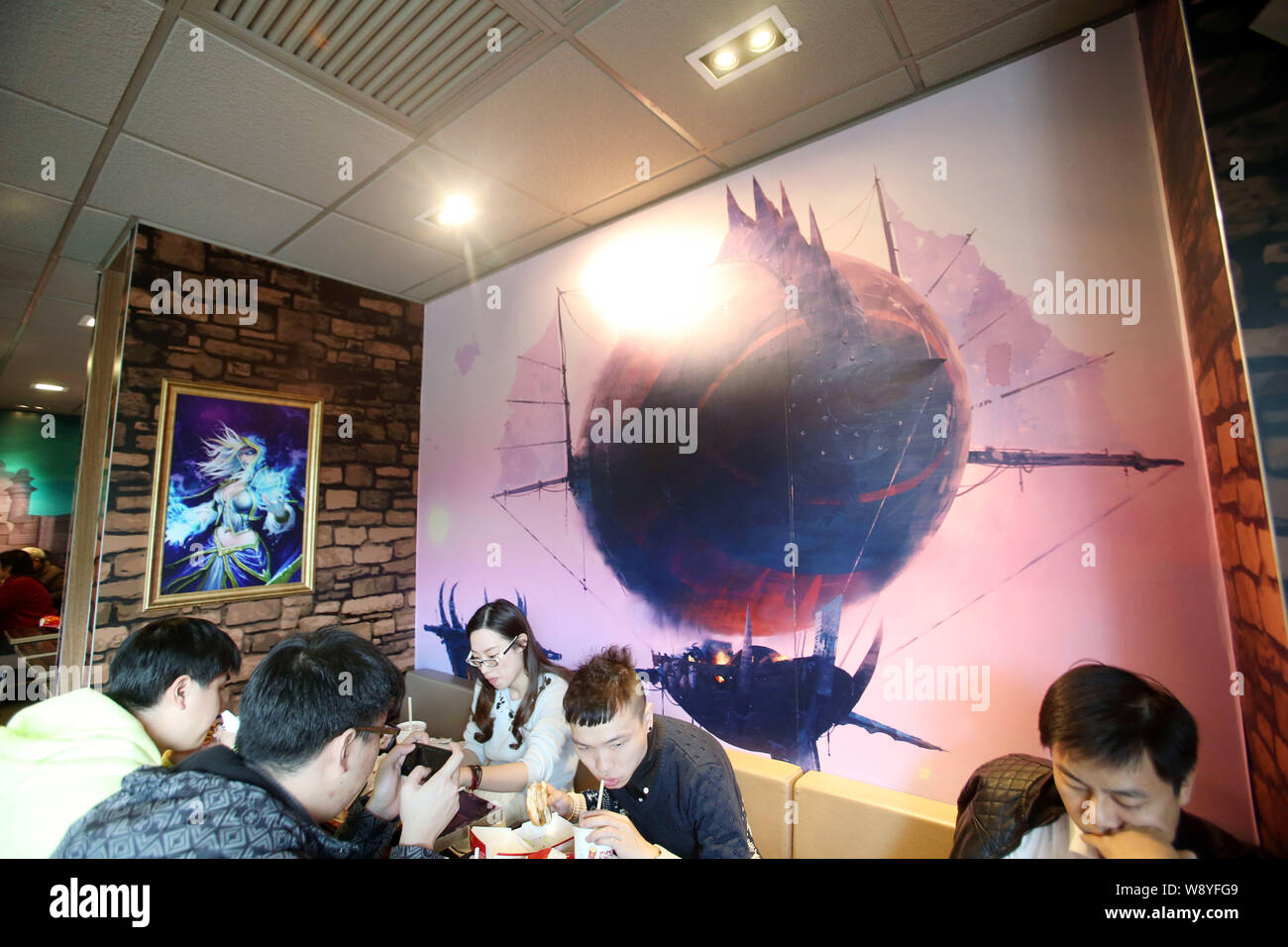 Customers eat food at a WorldofWarcraftthemed fastfood restaurant of McDonald