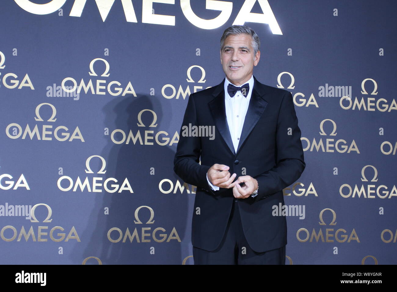 American actor George Clooney poses as he arrives at the Omega Le Jardin Secret party in Shanghai, China, 16 May 2014.   Hollywood actor George Cloone Stock Photo